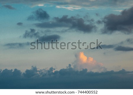 The nature view photo of various kinds and shape of cloud  during the twilight of sunset or sunrise with two colors blue and yellow in the nature.