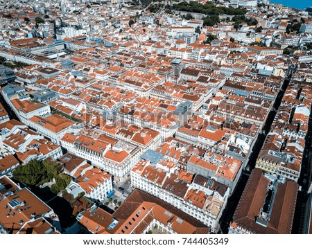 Aerial drone photo - Colorful orange roofs of the Alfama district of Lisbon Portugal