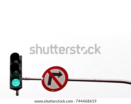 Traffic signs do not turn right. And the traffic light tells the green light. On a white background