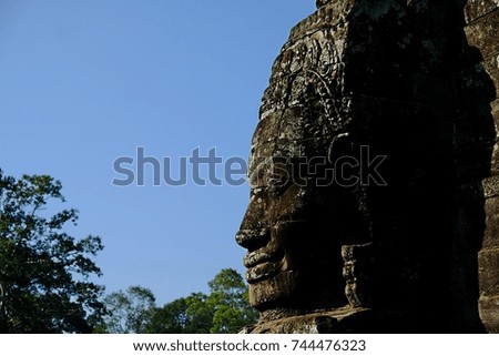 Castle of the Smile, Ancient stone faces of Bayon temple, Angkor, Cambodia.
