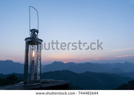 Candle lantern with forest Mountain view