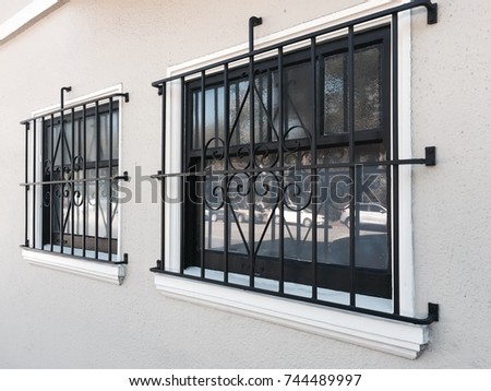 windows with grill steel Royalty-Free Stock Photo #744489997