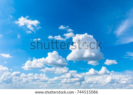 Light blue sky with clouds, used as background
