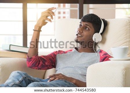 indian teenage male listening to music