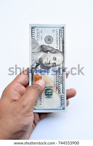 close up of banknote on hand isolated on white background