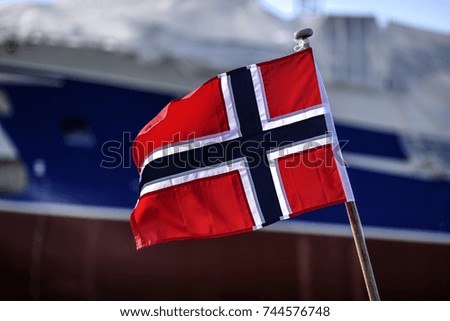 Norway flag waving in the harbor of Skagen, Denmark.