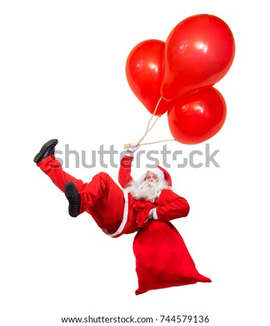 Funny flying Santa Claus falls with a bag full of x-mas gifts. Falling Santa holds air balloons isolated on white background. Santa Claus hover with balloon and carry sack with gift box.