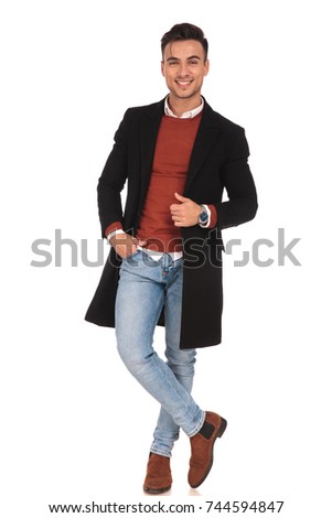 laughing young man standing on white background, full body picture