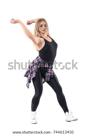 Energetic jazz dance female dance instructor swinging arms behind head with closed eyes. Full body length portrait isolated on white background. 
