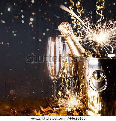 Sparkling New Year background. Champagne Explosion With Toast Of Flutes. Party Feeling with Sparklers and Champagne. New Years Eve celebration 