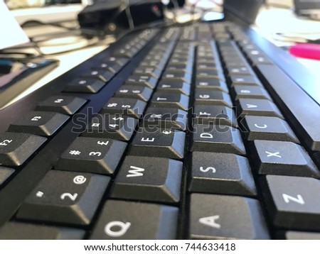 Working from home concept. Side view of a Computer keyboard close up. 