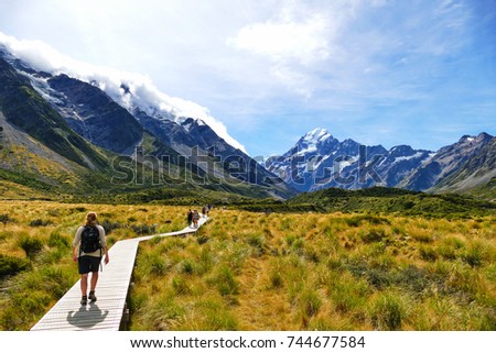 Walking along the great winding Hooker Valley track at Mount Cook, New Zealand.
 (19-03-2017) Royalty-Free Stock Photo #744677584