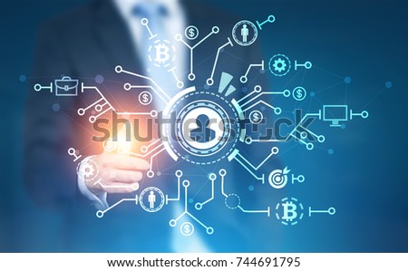 Unrecognizable businessman with a glowing finger pointing at a network hologram. Blurred blue background. Toned image double exposure