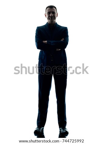 one caucasian business man standing arms crossed silhouette isolated on white background