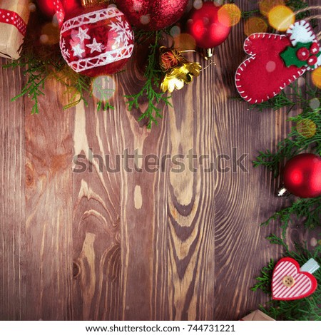 Border of Christmas decorations with copyspace.Christmas fir tree with decoration on dark wooden board