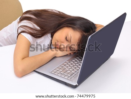 The beautiful business woman sleeps on the keyboard on a white background