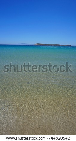 Photo of famous beach with turquoise clear waters, a surfer's paradise, Chrysi Akti, Paros, Cyclades, Greece