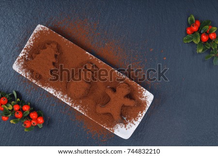 Holiday Food concept Homemade Chocolate truffle in Christmas and new year decor shape on black slate stone with copy space