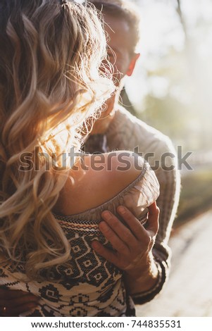 portrait of couple in autumn on nature, love