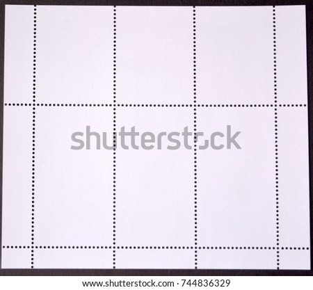  reverse side of the block of postage stamps on a black background. texture