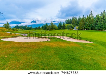 Sand bunkers at the golf course fall, autumn season.