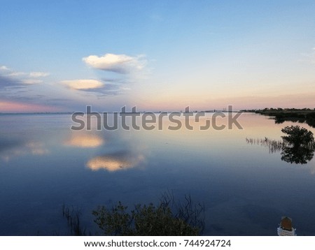 Calm Bay waters  Royalty-Free Stock Photo #744924724