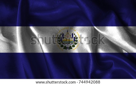 Realistic flag of El Salvador on the wavy surface of fabric. This flag can be used in design.