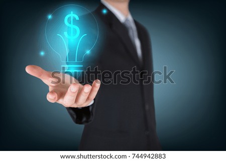 Businessman holding the glowing dollar bulb as business, innovation, intelligent, idea, income and investment concept
