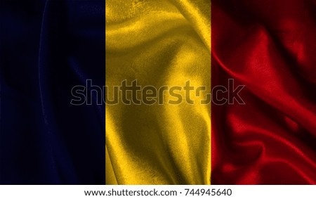 Realistic flag of Chad on the wavy surface of fabric. This flag can be used in design.