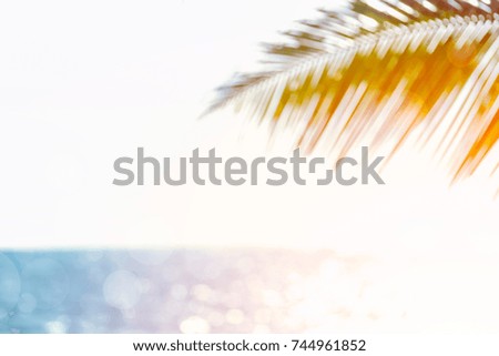 Blurred image of sea and coconut tree. Concept of beach in summer.