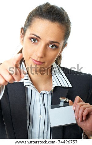 young attractive businesswoman holds her badge and point with her finger to camera, isolated on white