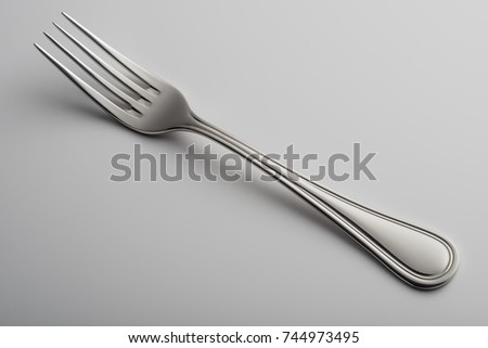 Empty Single steel Fork isolated on white background
