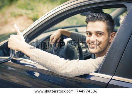 young man in the car, okay