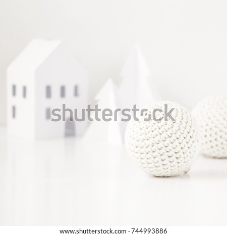 White paper trees, house and crochet Christmas balls