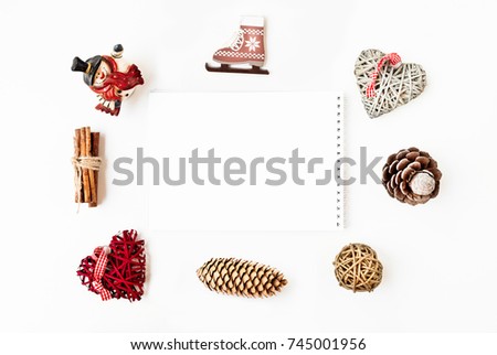Christmas decorations and objects for mock up template design. Notebook with free sapce. Christmas hearts, cinnamon, santa claus, cones, ice skating View from above. Flat lay. Xmas.  Christmas theme