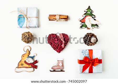 Christmas decorations and objects for mock up template design. Christmas gift box, christmas hearts, cinnamon, cones, ice skating View from above. Flat lay. Xmas decorations