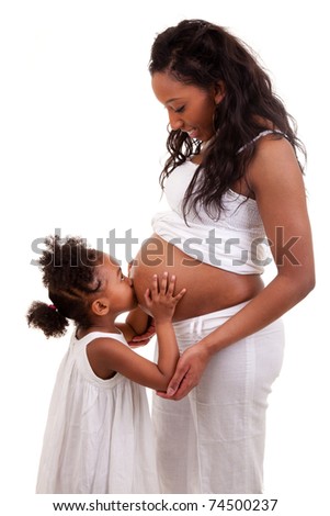 Pregnant black woman with her daughter