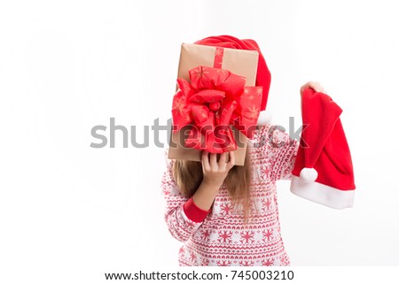 beautiful caucasian girl holding a big gift in hands. Christmas concept