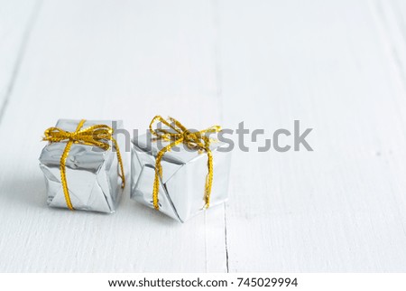 gift boxes on white wood texture