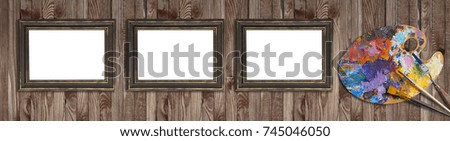 Palette for oil paints with brushes, palette knife and picture frames on shabby wooden background. Template for oil art master class advertising. Empty place for photo or text.