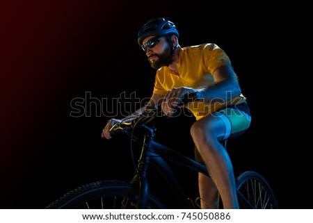 The bicyclist on black, studio shot.