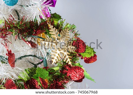 The decoration of Christmas tree in white background. White Christmas concept.