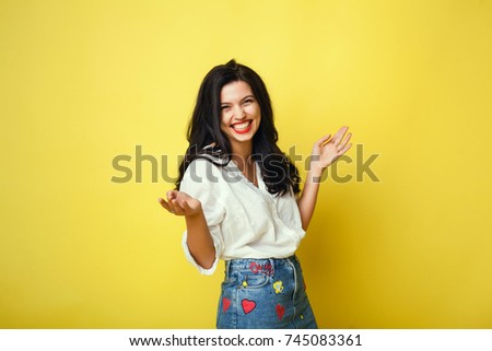 Beauty women portrait in a studio, isolated, yellow color, red lips, cute, happy face, smile, beauty brunette female, home, denim, cute. hair pretty, red lips, emotional portrait, love