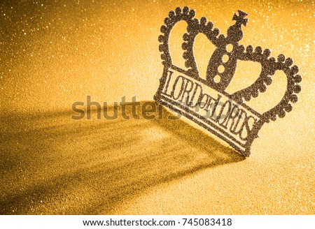 Lord of Lords, the word in the crown with gold background.