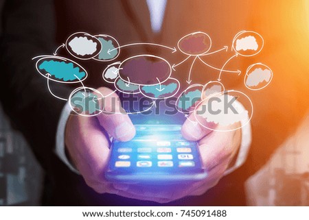 View of Hand drawn chart organization icon going out a smartphone interface of a businessman at the office - Business concept