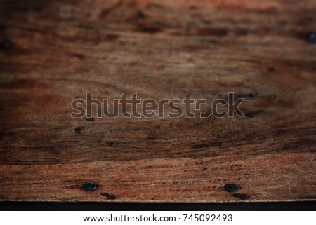 Rustic dark brown wood background with bough structure and short depth of field