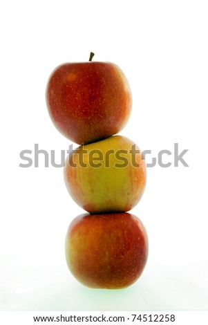 Three apples in a heap, isolated on white