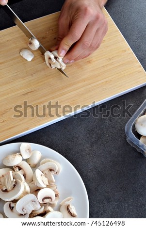 Close up - Slice mushrooms in the kitchen