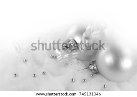 silver xmas ornaments on bright holiday background with space for text. Merry christmas!
Happu New Year.