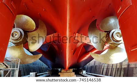 Detail of double propellers at dry dock Royalty-Free Stock Photo #745146538